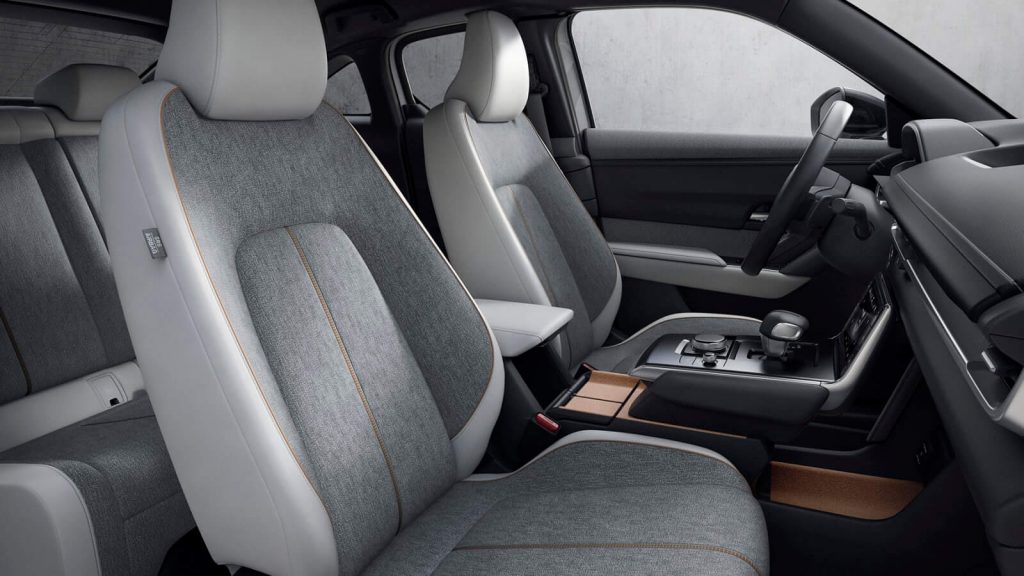 Looking inside the front seat area of the 2022 Mazda MX-30 SUV from the passenger side.